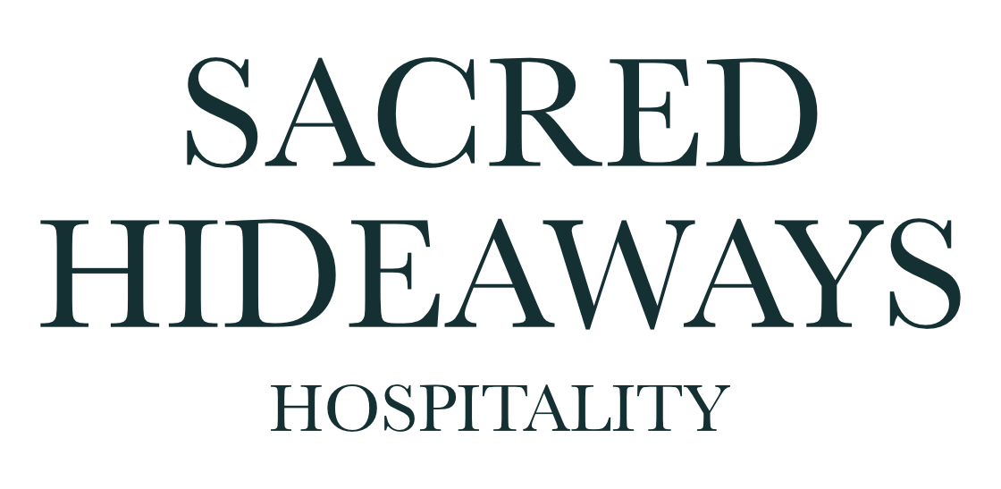 Sacred Hideaways Hospitality dark logo